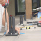 Matte black spigots on an outdoor deck after rain