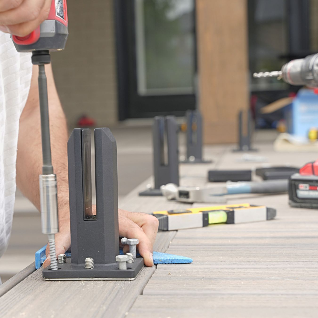 Matte black spigots on an outdoor deck after rain