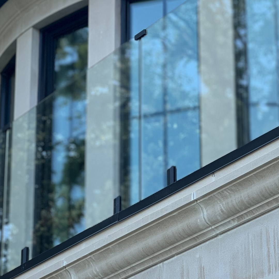 glass railing installed on modern balcony with clear panels