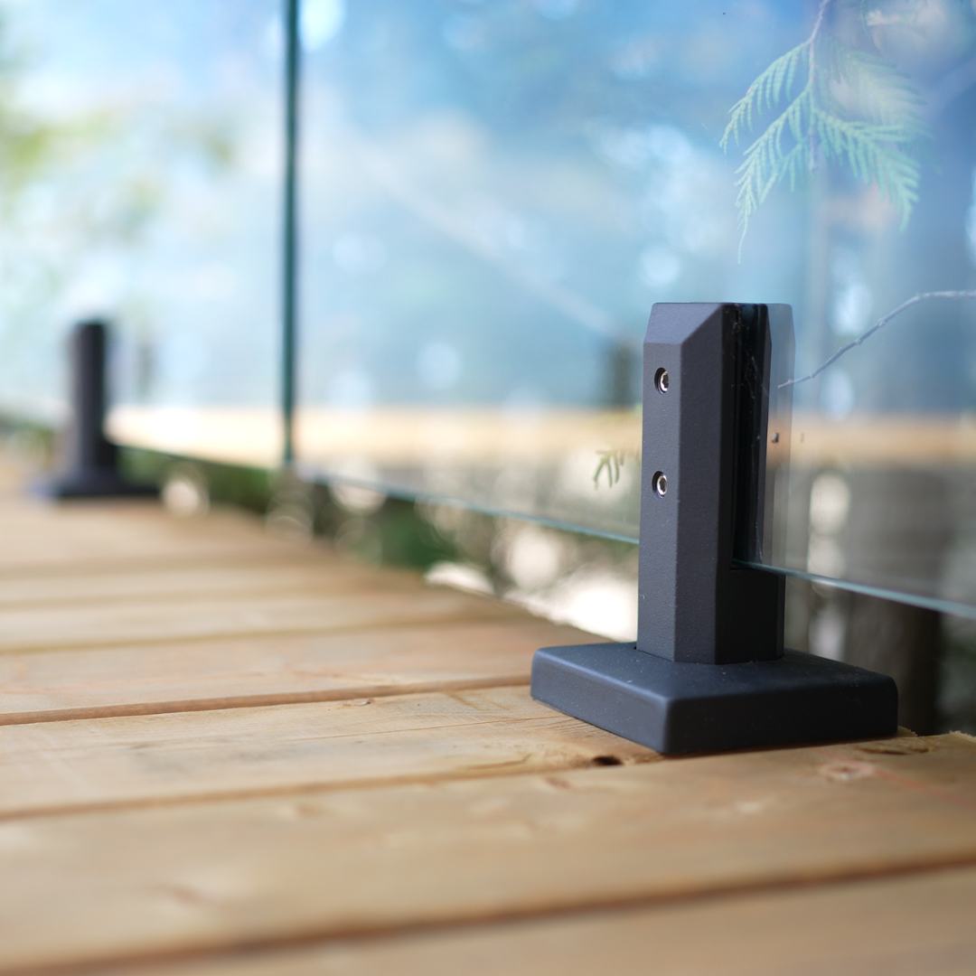 glass railing spigot securely holding tempered glass panel in place