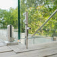 Floor lock securing a frameless glass pool fence gate into the ground