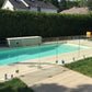 Glass railing surrounding a poolside deck