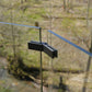 Adjustable glass railing connector mounted on a deck