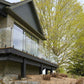 Tempered glass deck railing in a backyard patio