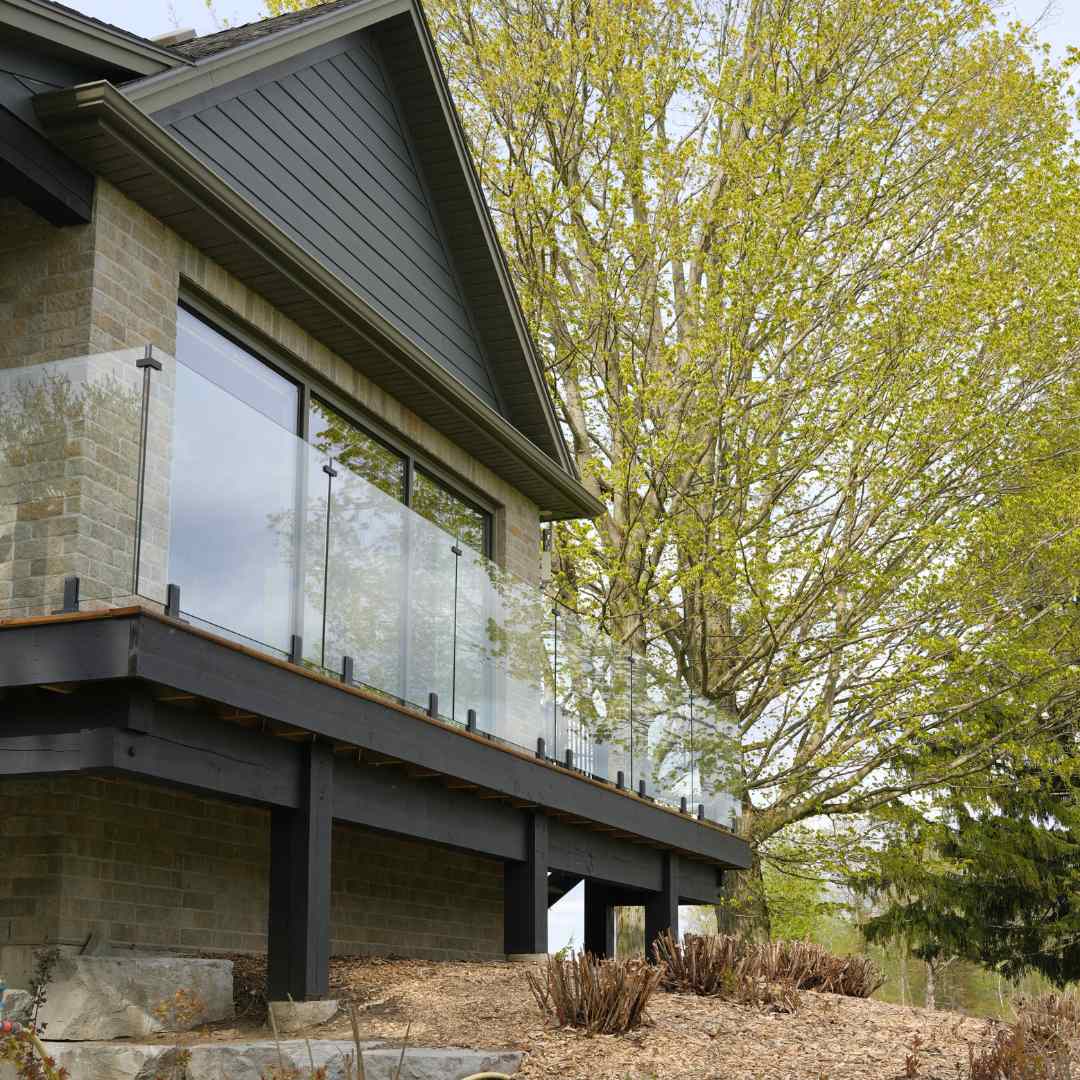 Tempered glass deck railing in a backyard patio
