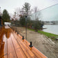 Frameless glass railing on a lakeside deck