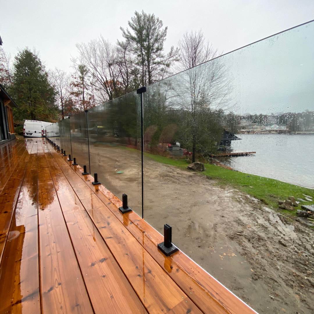 Frameless glass railing on a lakeside deck