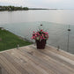 frameless glass railing installed on cottage deck with open lake view