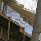 Glass railing around an outdoor living patio