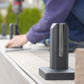 Matte black spigot core-mounted into a concrete surface
